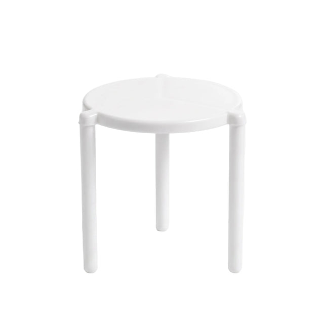 A minimalist white plastic stool with a round seat and three legs, photographed on a seamless white studio background.