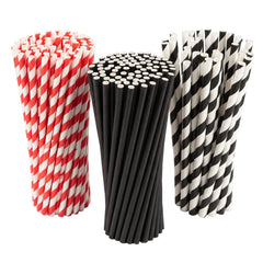 Three bundled reusable paper straws on a white background: red and white striped on the left, solid black in the center, and black and white striped on the right.